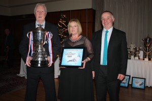 Liam McCall collects the Kings Cup from last seasons winners Mr & Mrs Magill